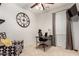 Home office with desk, chair, and large clock at 739 E Lovebird Ln, Gilbert, AZ 85297