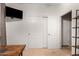 Home office with desk, TV, and closet at 739 E Lovebird Ln, Gilbert, AZ 85297