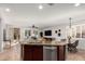 Island kitchen with breakfast bar overlooks the living room at 739 E Lovebird Ln, Gilbert, AZ 85297