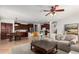 Open living area with sectional sofa, and kitchen view at 739 E Lovebird Ln, Gilbert, AZ 85297