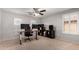 Home office with built-in shelving and dual monitors at 739 E Lovebird Ln, Gilbert, AZ 85297