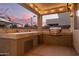 Built-in outdoor kitchen with grill and stone countertops at 739 E Lovebird Ln, Gilbert, AZ 85297