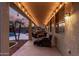 Covered patio with string lights, comfortable seating, and pool view at 739 E Lovebird Ln, Gilbert, AZ 85297
