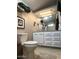 Main bathroom features toilet and double vanity at 7750 E Broadway Rd # 125, Mesa, AZ 85208