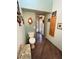 Clean bathroom with toilet and access to laundry area at 7750 E Broadway Rd # 125, Mesa, AZ 85208