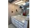 Bathroom with double vanity, granite countertop, and shower at 7750 E Broadway Rd # 125, Mesa, AZ 85208