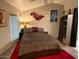 Bedroom with a ceiling fan and red carpet at 7750 E Broadway Rd # 125, Mesa, AZ 85208