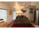 Spacious bedroom with ceiling fan and large bed at 7750 E Broadway Rd # 125, Mesa, AZ 85208