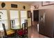 Bright dining area with glass table and four chairs, adjacent to kitchen at 7750 E Broadway Rd # 125, Mesa, AZ 85208
