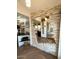Entryway with stone feature wall and wood floors at 7750 E Broadway Rd # 125, Mesa, AZ 85208