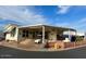 Single-wide manufactured home with covered patio and carport at 7750 E Broadway Rd # 125, Mesa, AZ 85208