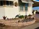 Landscaped yard with drought-tolerant plants and rock accents at 7750 E Broadway Rd # 125, Mesa, AZ 85208