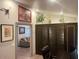 Home office with built-in storage and a view of living room at 7750 E Broadway Rd # 125, Mesa, AZ 85208