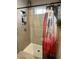 Walk-in shower with glass enclosure and tile surround at 7750 E Broadway Rd # 125, Mesa, AZ 85208