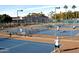 Multiple tennis courts with spectators area at 7750 E Broadway Rd # 125, Mesa, AZ 85208