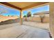 Covered patio overlooking a sandy backyard at 7819 S 25Th Ave, Phoenix, AZ 85041