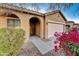 Front entry with double arches and wooden door at 7819 S 25Th Ave, Phoenix, AZ 85041