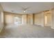 Living Room with carpet, ceiling fan and access to hallway at 7819 S 25Th Ave, Phoenix, AZ 85041