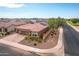 Single-story home with solar panels, two-car garage, and landscaped yard at 809 W Palo Verde Dr, Casa Grande, AZ 85122