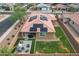 Aerial view of house showcasing backyard, patio, and solar panels at 809 W Palo Verde Dr, Casa Grande, AZ 85122
