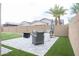 Relaxing backyard patio with seating area and artificial turf at 809 W Palo Verde Dr, Casa Grande, AZ 85122