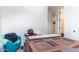 Small bedroom with a twin-size bed and chair at 809 W Palo Verde Dr, Casa Grande, AZ 85122