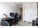 Bedroom with a desk, gaming chair, and large closet at 809 W Palo Verde Dr, Casa Grande, AZ 85122