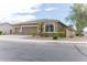 Tan house with a three-car garage and desert landscaping at 809 W Palo Verde Dr, Casa Grande, AZ 85122