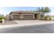 Three-car garage home with desert landscaping and neutral exterior at 809 W Palo Verde Dr, Casa Grande, AZ 85122
