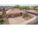 Single-story home with tile roof, two-car garage, and landscaped yard at 809 W Palo Verde Dr, Casa Grande, AZ 85122