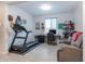 Home gym with treadmill, desk, and comfortable seating at 809 W Palo Verde Dr, Casa Grande, AZ 85122