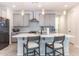 Modern kitchen with gray cabinets, quartz countertops, and stainless steel appliances at 809 W Palo Verde Dr, Casa Grande, AZ 85122