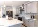 Modern kitchen with gray cabinets, quartz countertops, and stainless steel appliances at 809 W Palo Verde Dr, Casa Grande, AZ 85122