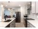 Modern kitchen with gray cabinets, quartz countertops, and stainless steel appliances at 809 W Palo Verde Dr, Casa Grande, AZ 85122