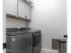 Laundry room with washer, dryer, and cabinets at 809 W Palo Verde Dr, Casa Grande, AZ 85122