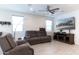 Relaxing living room with comfortable seating and large TV at 809 W Palo Verde Dr, Casa Grande, AZ 85122