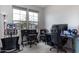 Home office with a large window, desk, and gaming chair at 809 W Palo Verde Dr, Casa Grande, AZ 85122