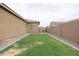 Landscaped side yard with grass and gravel border at 809 W Palo Verde Dr, Casa Grande, AZ 85122