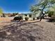 House with a gravel backyard and mature trees at 8500 E Southern Ave # 405, Mesa, AZ 85209