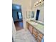Bathroom features a vanity, sink, and view of bedroom at 8500 E Southern Ave # 405, Mesa, AZ 85209