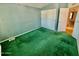 Bedroom with green carpet and double door closet at 8500 E Southern Ave # 405, Mesa, AZ 85209