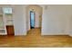 Light-filled hallway with wood flooring and built-in shelves at 8500 E Southern Ave # 405, Mesa, AZ 85209