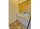 Laundry area with washer, dryer, and cabinets at 8500 E Southern Ave # 405, Mesa, AZ 85209