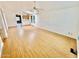 Spacious living room featuring wood-look floors and ceiling fan at 8500 E Southern Ave # 405, Mesa, AZ 85209