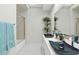 Modern bathroom with double sinks and a large walk-in shower at 9045 E Chino Dr, Scottsdale, AZ 85255