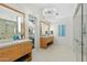 Spa-like bathroom with double sinks, large shower, and soaking tub at 9045 E Chino Dr, Scottsdale, AZ 85255