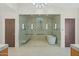 Spa-like bathroom with a large walk-in shower and soaking tub at 9045 E Chino Dr, Scottsdale, AZ 85255