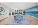 Open concept dining room with large table and statement wall art at 9045 E Chino Dr, Scottsdale, AZ 85255