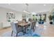 Spacious dining area with a modern table and access to a patio at 9045 E Chino Dr, Scottsdale, AZ 85255