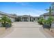 Front view of a luxurious home with a large driveway at 9045 E Chino Dr, Scottsdale, AZ 85255